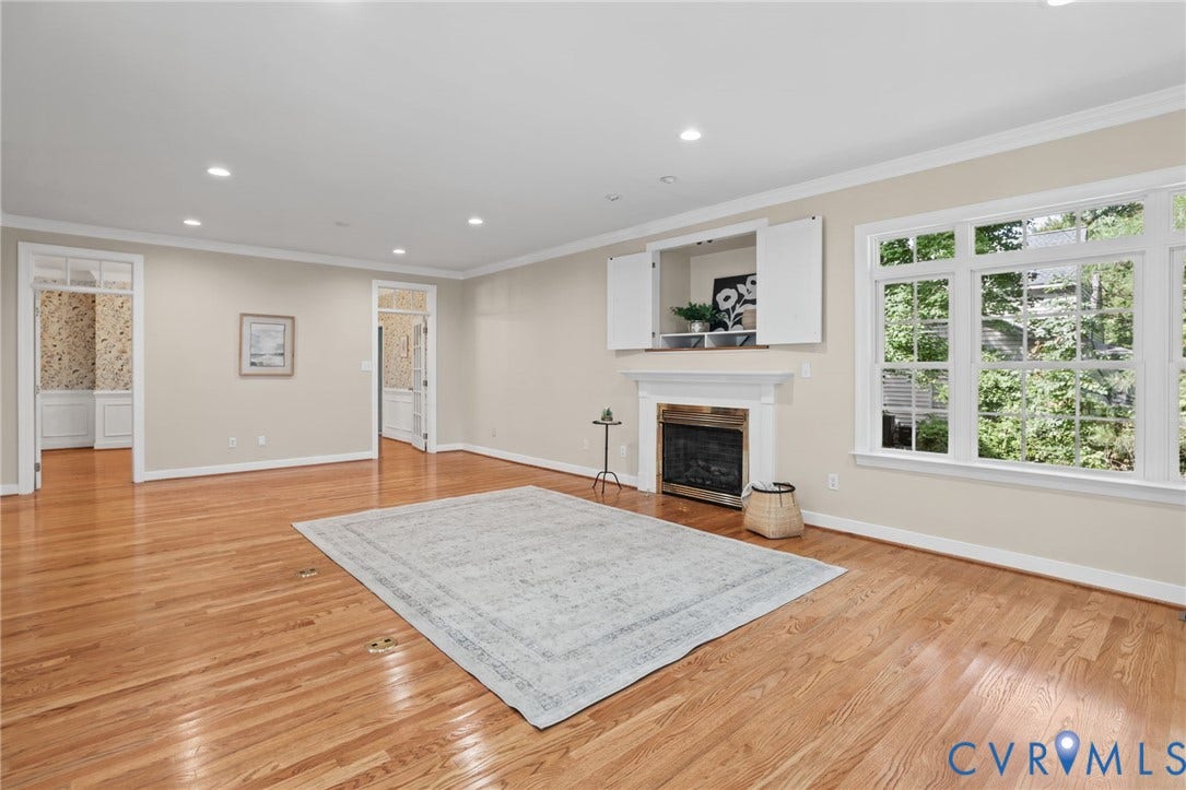 3600 Rivermist Terrace, Midlothian, VA 23113 Hardwood flooring, recessed lighting, white trim and crown molding, fireplace with mantel, built-in media cabinet