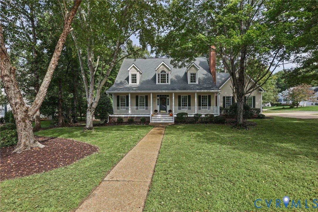 3600 Rivermist Terrace, Midlothian, VA 23113 Traditional-style home featuring dormer windows, a covered front porch with white railing, and a red brick chimney