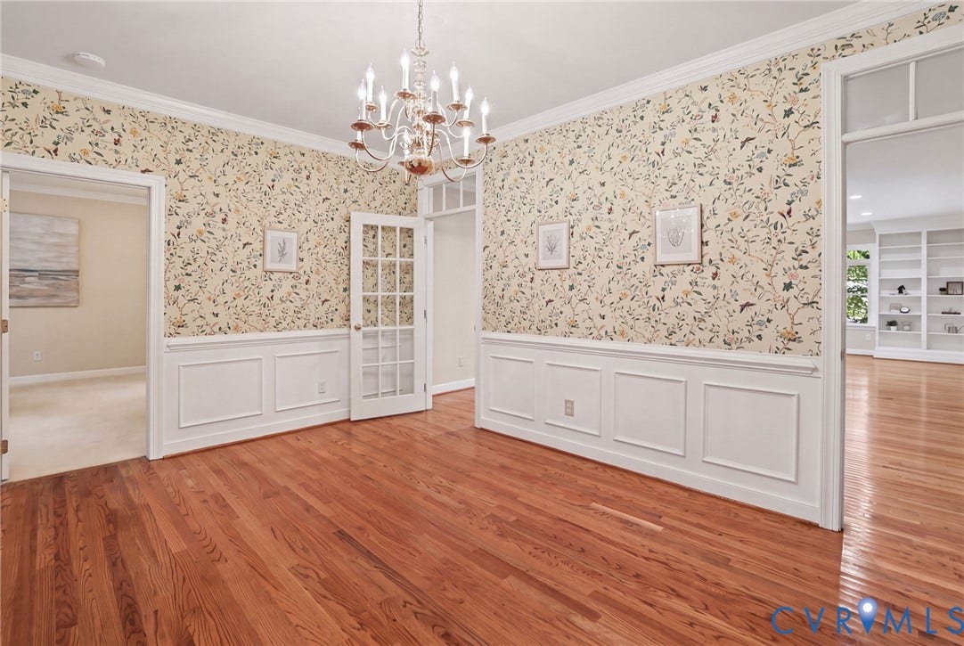 3600 Rivermist Terrace, Midlothian, VA 23113 Hardwood flooring, decorative wallpaper, wainscoting, crown molding, and a chandelier