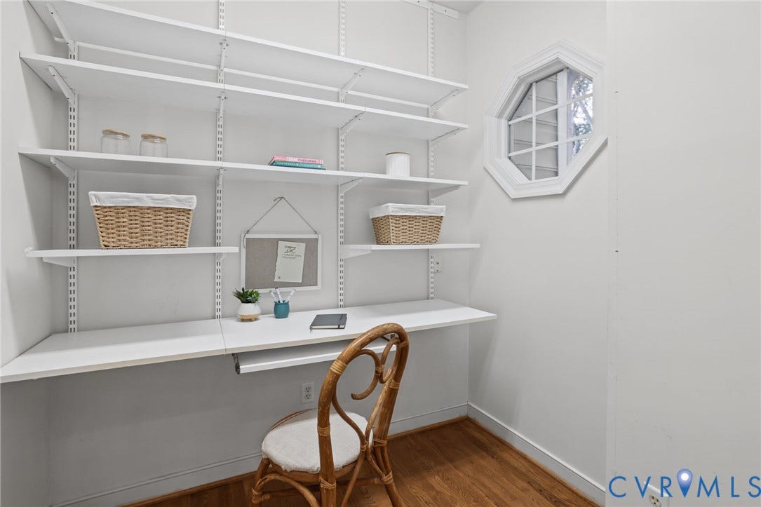 3600 Rivermist Terrace, Midlothian, VA 23113 Built-in shelving system with an integrated desk, octagonal window, and wood-finish flooring