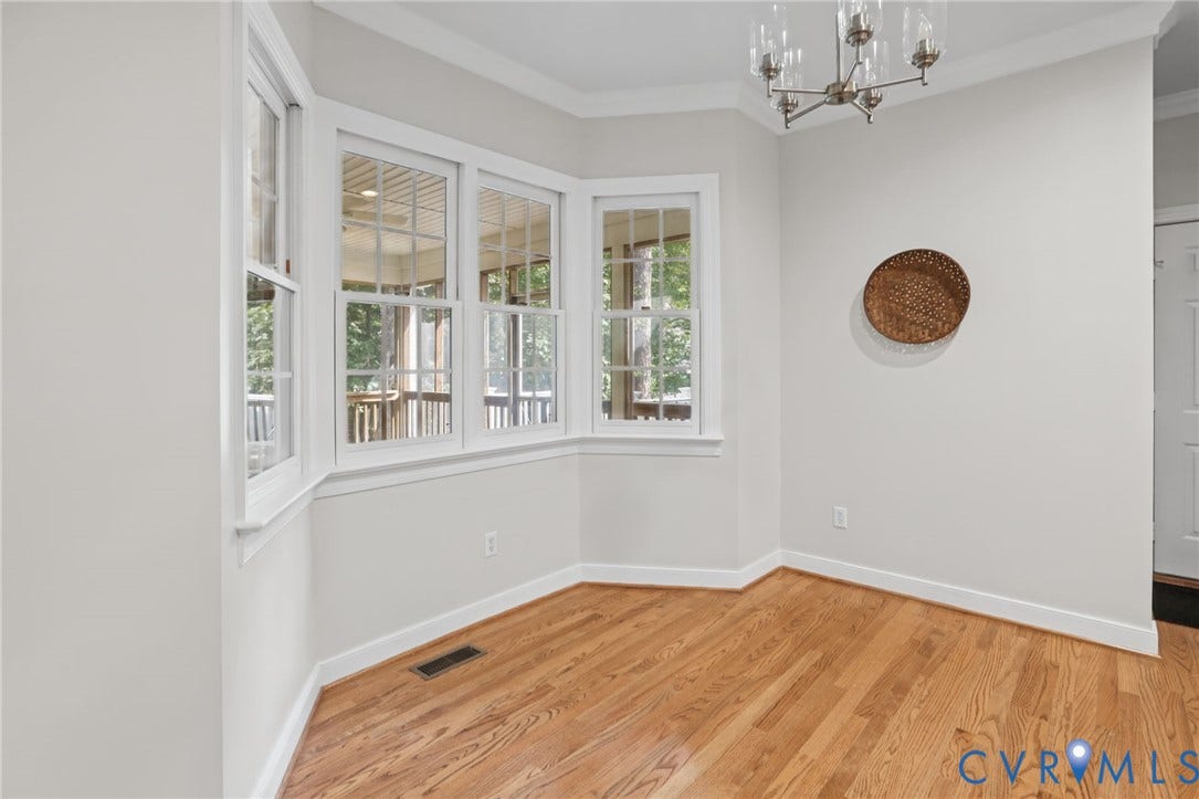 3600 Rivermist Terrace, Midlothian, VA 23113 Bay window, hardwood flooring, crown molding, and a built-in chandelier