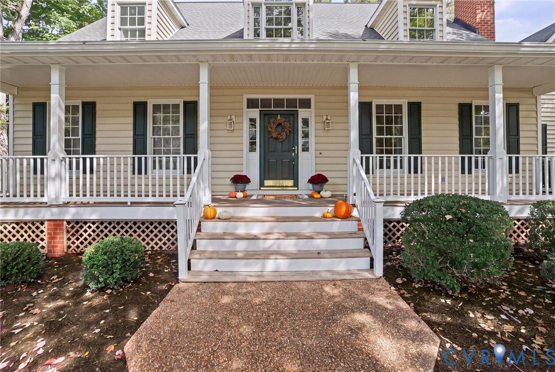 3600 Rivermist Terrace, Midlothian, VA 23113 Covered front porch with white column supports, light-colored siding, dark shutters, and a dark front door
