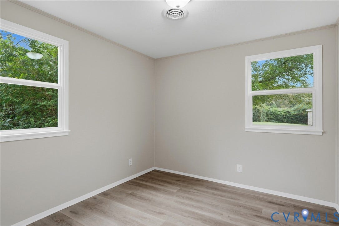 1814 Aeronca Avenue, Henrico, VA 23228 Neutral-toned walls complement wood-finish flooring