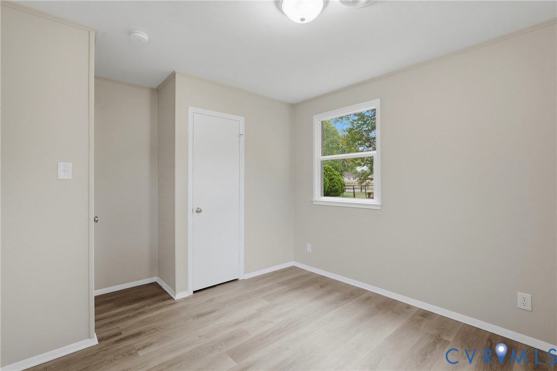 1814 Aeronca Avenue, Henrico, VA 23228 Wood-finish flooring, neutral wall tones, white trim, and a double-hung window