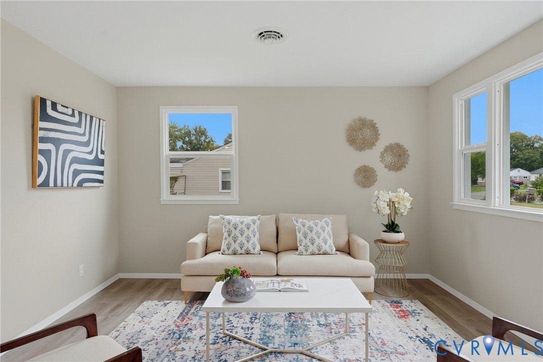 1814 Aeronca Avenue, Henrico, VA 23228 Neutral wall tones, wood-finish flooring, and multiple windows create a bright ambiance