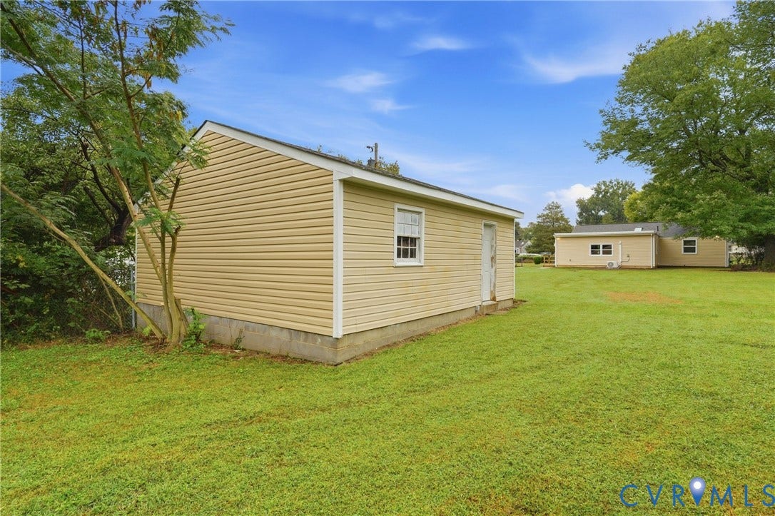 1814 Aeronca Avenue, Henrico, VA 23228 Detached structure featuring tan siding and a single window