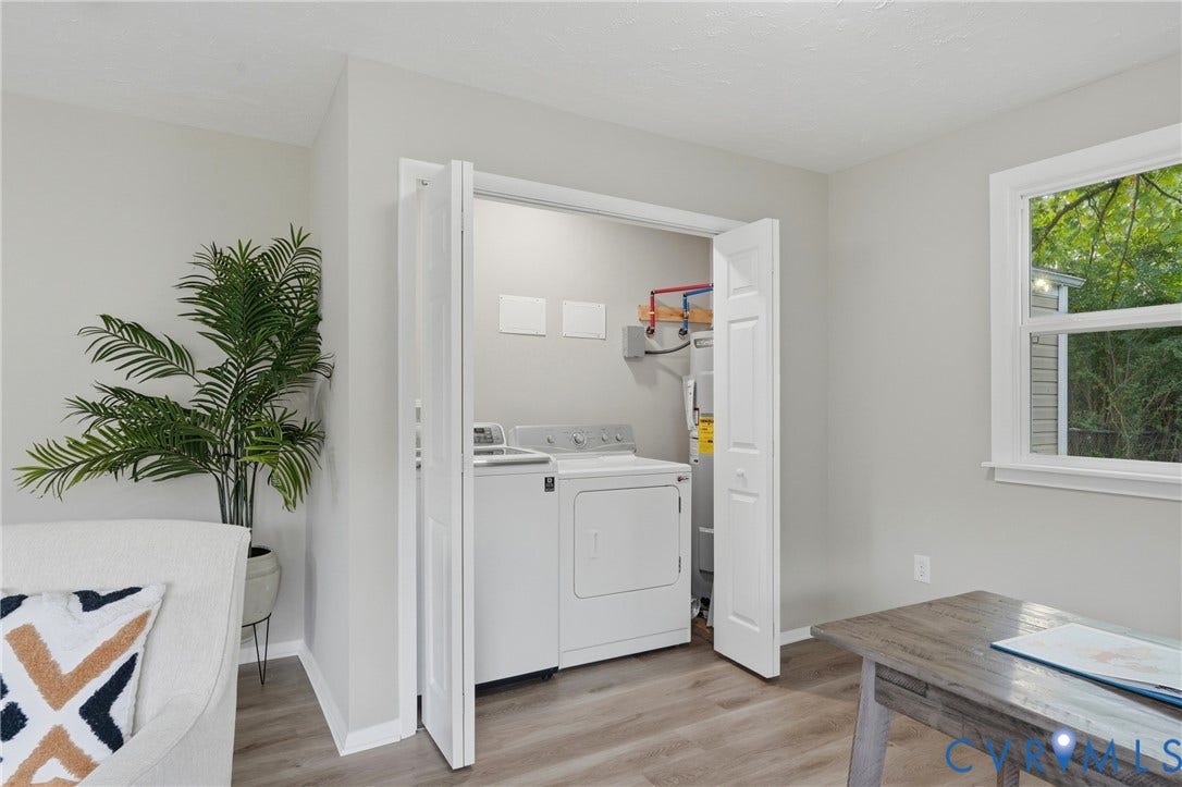 1814 Aeronca Avenue, Henrico, VA 23228 Laundry closet with bi-fold doors, wood-finish flooring, and a single window