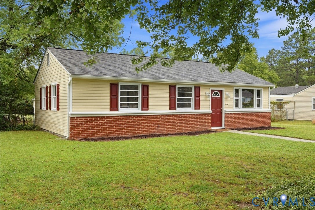 1814 Aeronca Avenue, Henrico, VA 23228 Single-story residence featuring light yellow siding, a partial brick facade, and a dark shingle roof