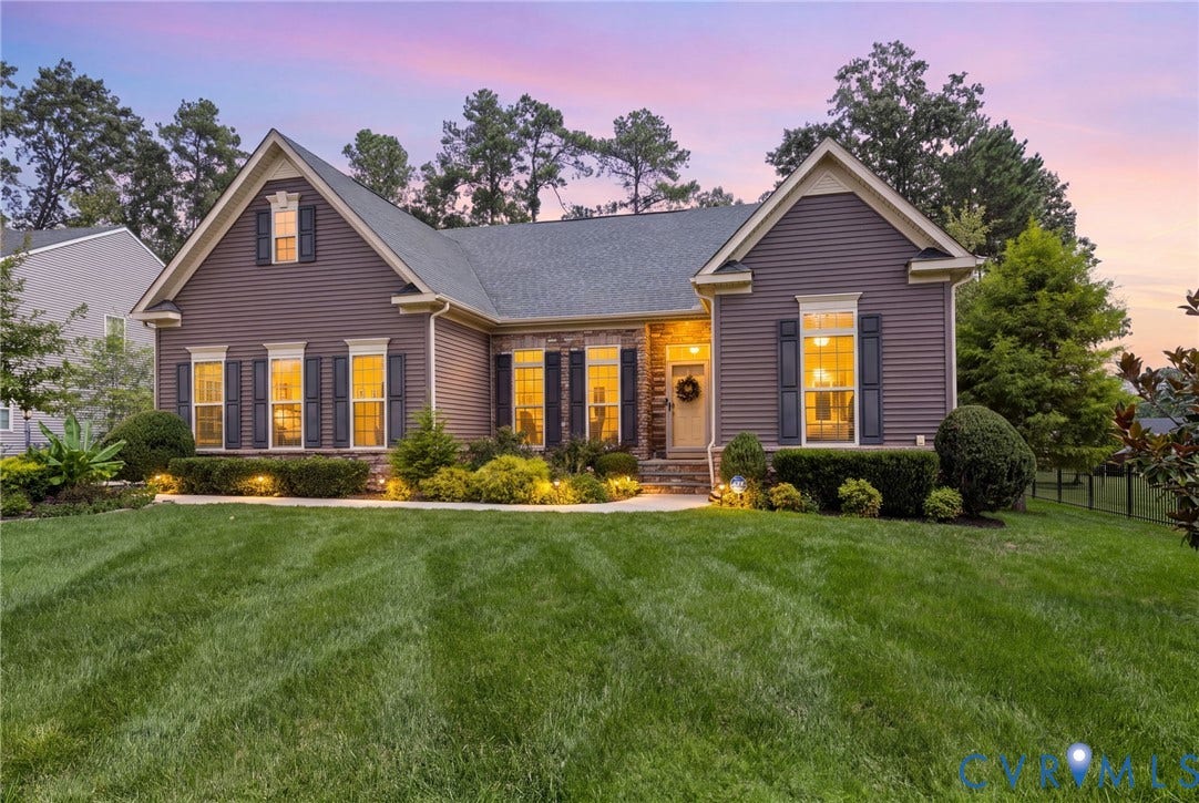 10662 Centralia Station Road, Chester, VA 23831 Siding exterior with stone accents, mature landscaping, and a manicured lawn