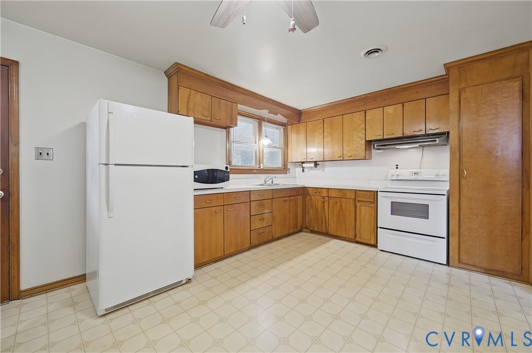 528 Duffton Road, Richmond, VA 23225 Wood cabinetry with white countertops, white range, and a ceiling fan with light fixture