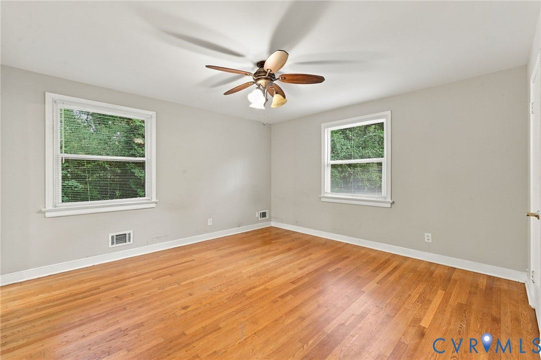 3238 E Weyburn Road, Bon Air, Richmond, VA 23235 Hardwood flooring, painted walls, two windows, and a ceiling fan with integrated lighting