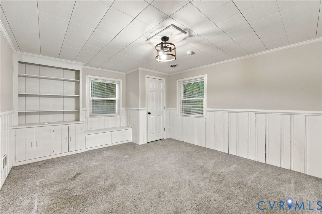 3238 E Weyburn Road, Bon Air, Richmond, VA 23235 Built-in cabinetry with shelving and lower storage, dual windows, wall paneling, and ceiling with recessed lighting