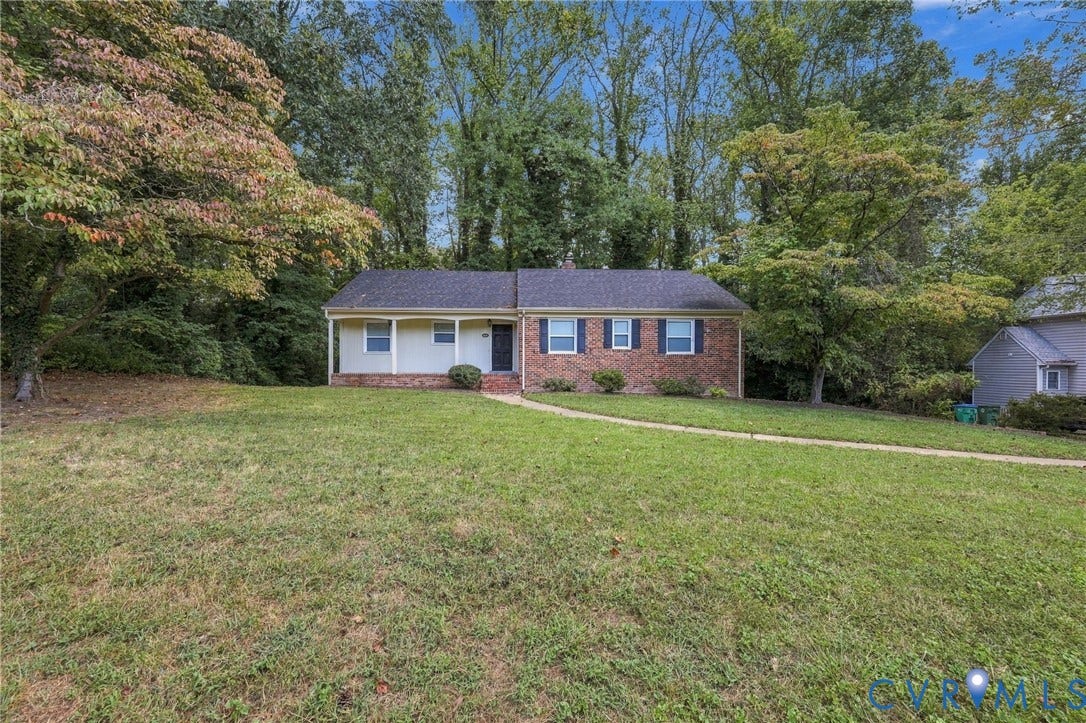3238 E Weyburn Road, Bon Air, Richmond, VA 23235 Brick and siding exterior with a dark shingle roof, featuring a covered porch and a paved walkway