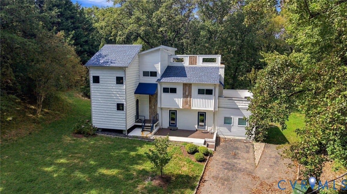 5824 Riverside Drive, Richmond, VA 23225 Multi-level facade with white siding and blue roofing