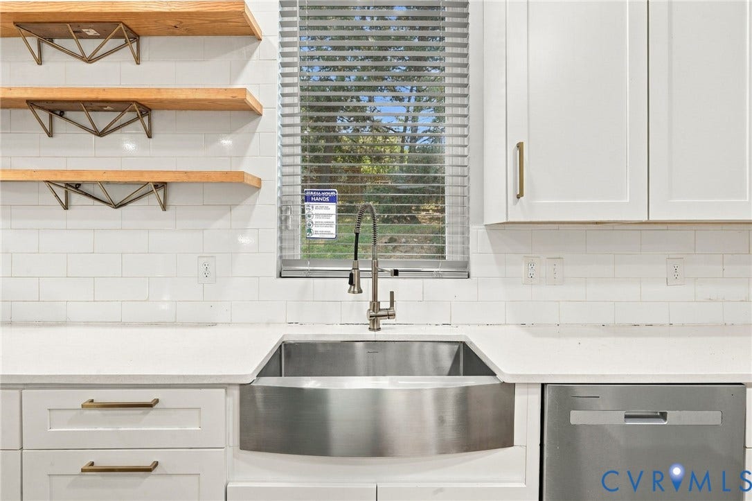 5824 Riverside Drive, Richmond, VA 23225 Stainless steel farmhouse sink with a gooseneck faucet