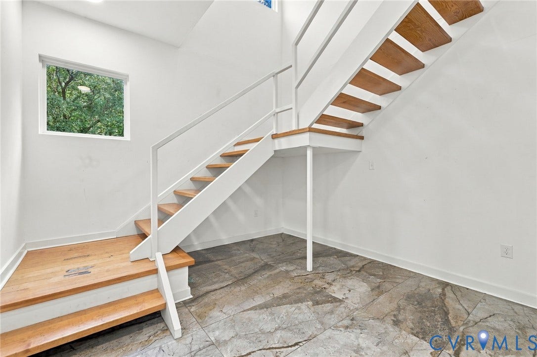5824 Riverside Drive, Richmond, VA 23225 Floating wood-finish staircase with white risers and modern railing