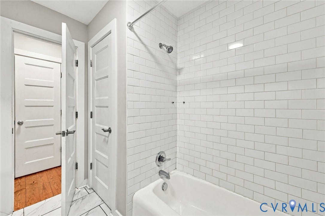 5824 Riverside Drive, Richmond, VA 23225 Bathtub with subway tile surround and chrome fixtures