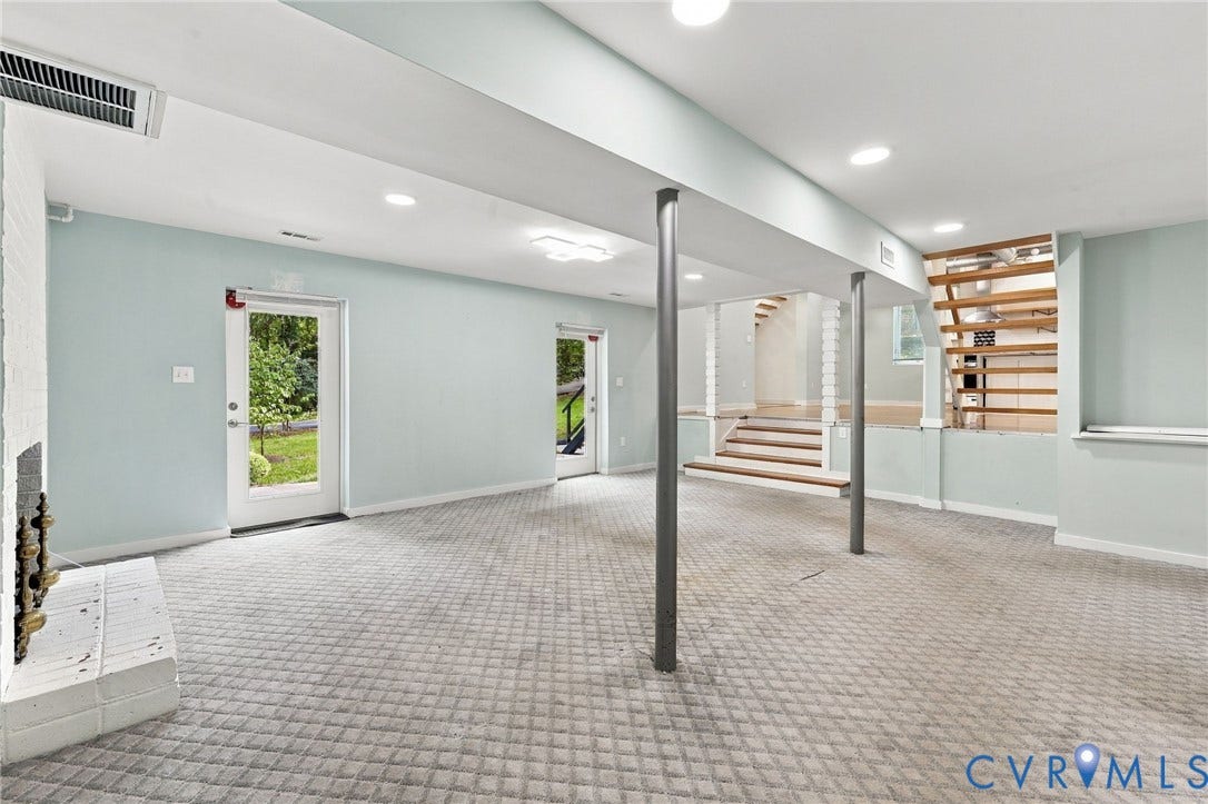5824 Riverside Drive, Richmond, VA 23225 Expansive carpeted area with recessed lighting, structural support columns, and dual glass-paneled doors
