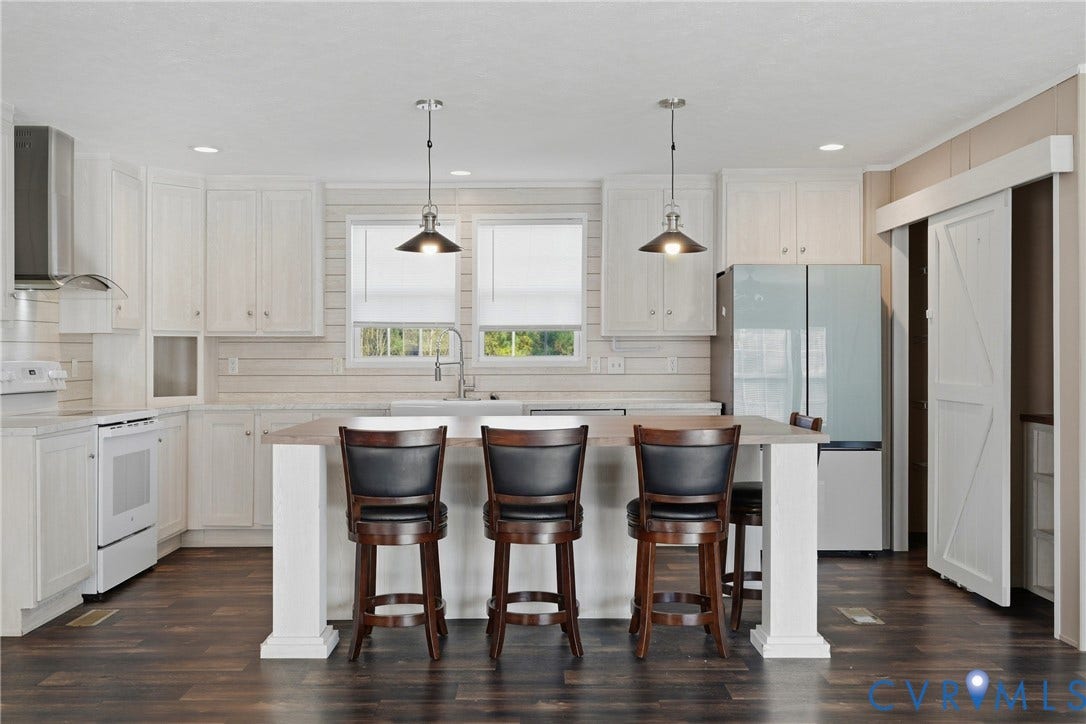 1385 Waltons Store Road, Hadensville North, Louisa, VA 23093 Kitchen featuring an island with pendant lighting, white cabinetry, a stainless steel range hood, and wood-finish flooring