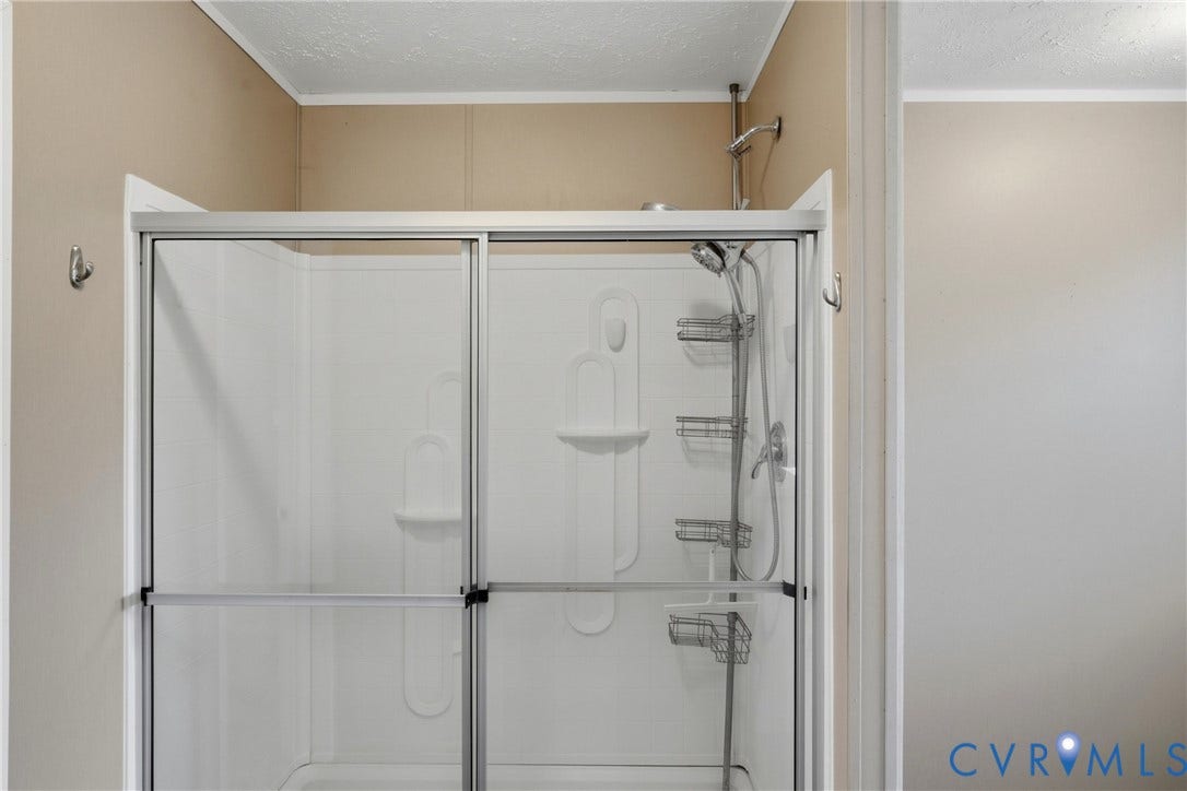 1385 Waltons Store Road, Hadensville North, Louisa, VA 23093 Shower enclosure with sliding glass doors and a built-in shelving system