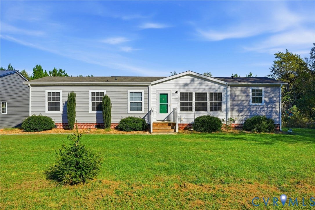 1385 Waltons Store Road, Hadensville North, Louisa, VA 23093 Gray siding exterior with white trim, green entry door, and a front deck