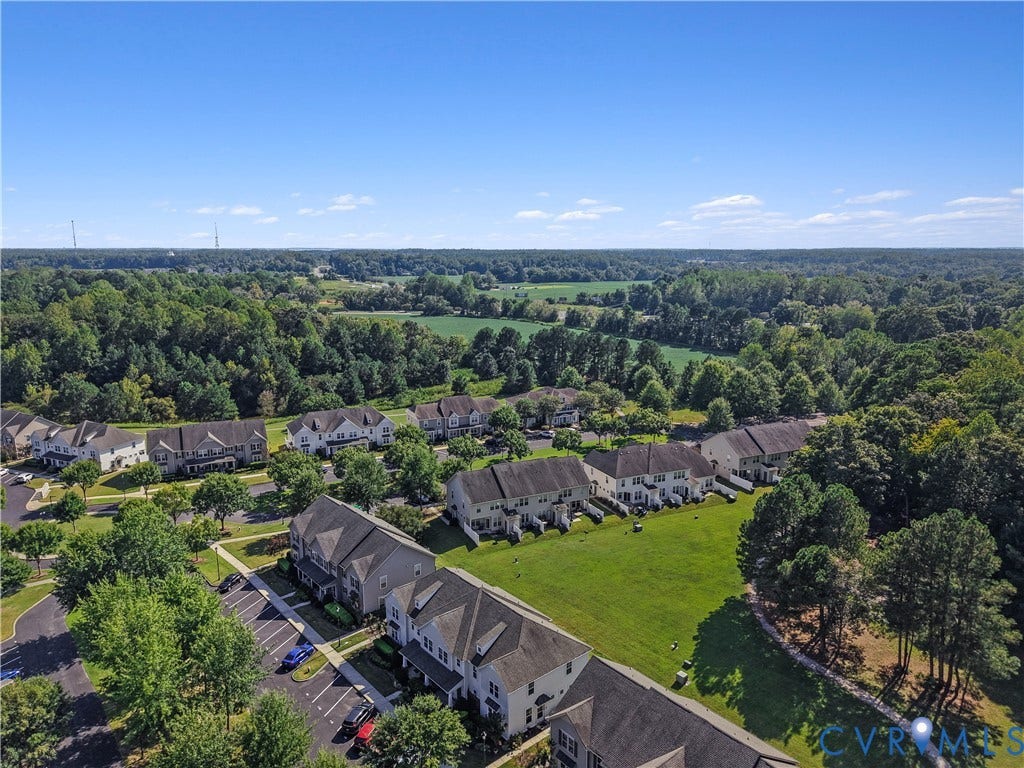 Expansive rural landscape surrounding a community of residential structures