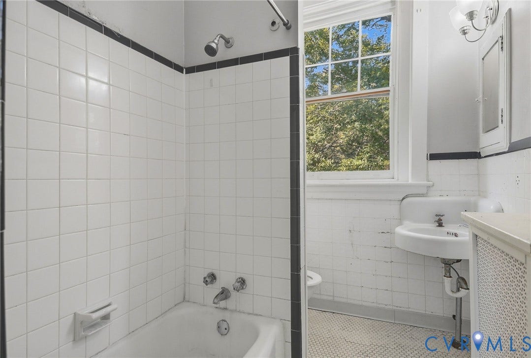216 W Roanoke Street, Richmond, VA 23225 White tile shower surround with black accent trim