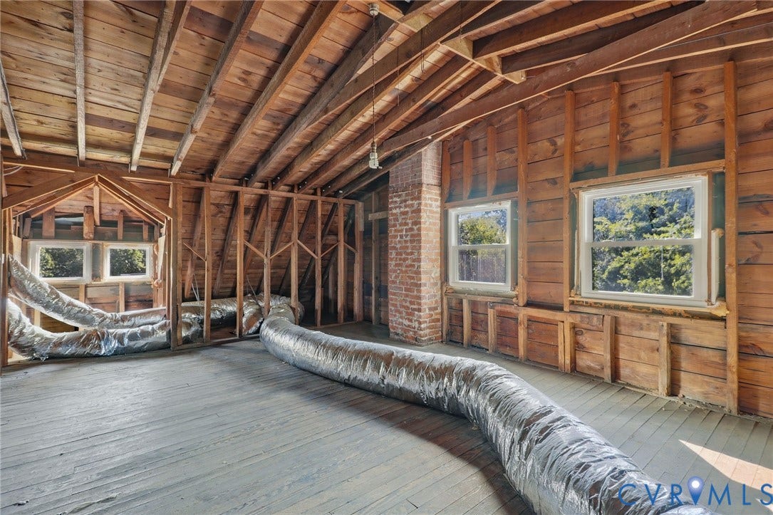216 W Roanoke Street, Richmond, VA 23225 Exposed wood framing, brick chimney, and multiple windows