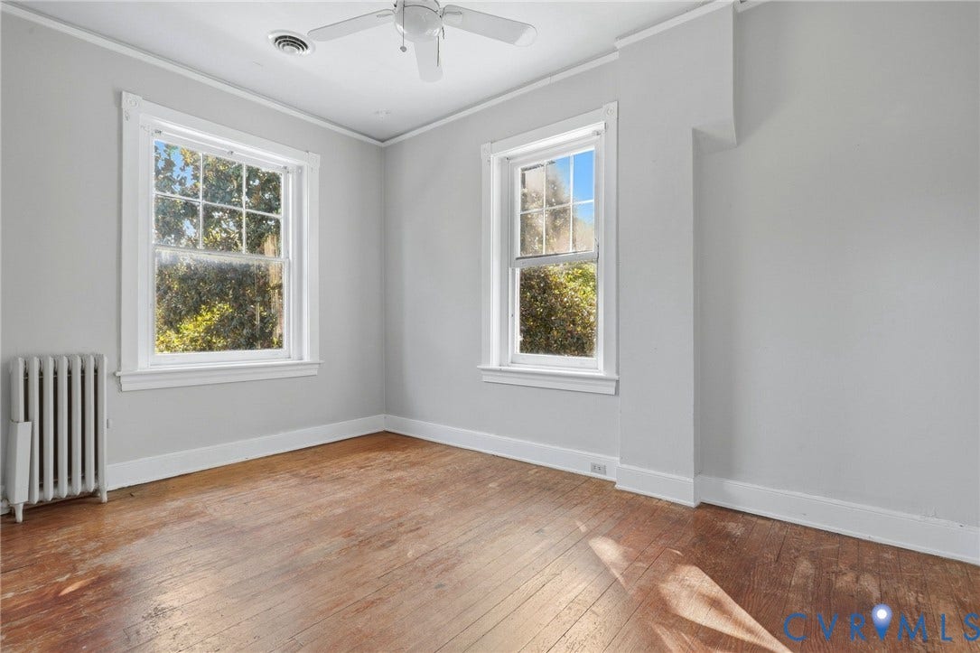 216 W Roanoke Street, Richmond, VA 23225 Hardwood flooring, painted walls, two large windows, white trim, and a ceiling fan