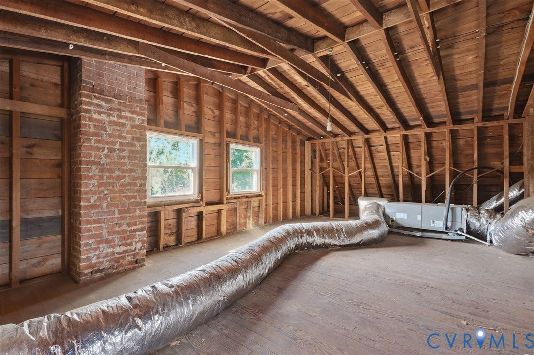 216 W Roanoke Street, Richmond, VA 23225 Exposed brick chimney and wood-plank flooring