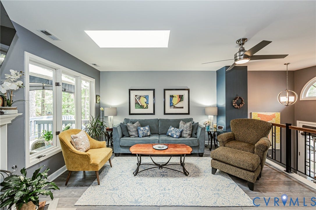 Wood-finish flooring, white trim, recessed lighting, and a ceiling fan