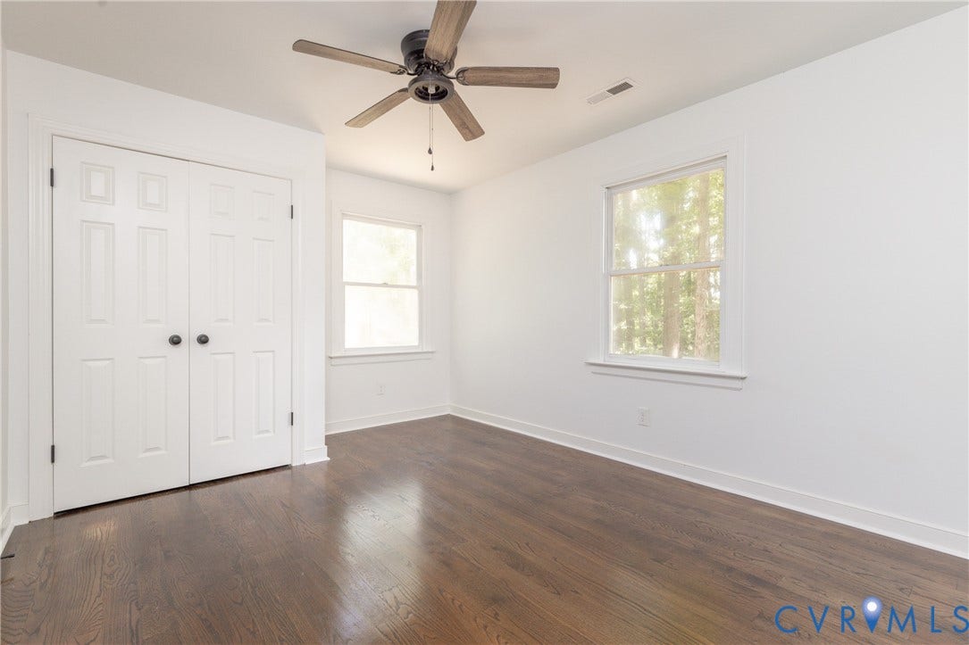 10541 Glencoe Road, Henrico, VA 23060 Wood-finish flooring, white trim, dual windows, and ceiling fan with integrated lighting