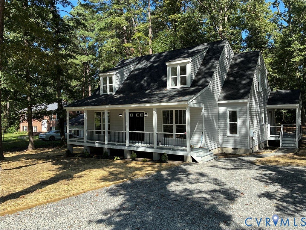 10541 Glencoe Road, Henrico, VA 23060 Light-colored siding exterior with a dark shingle roof, front porch with white railing, and multiple dormer windows