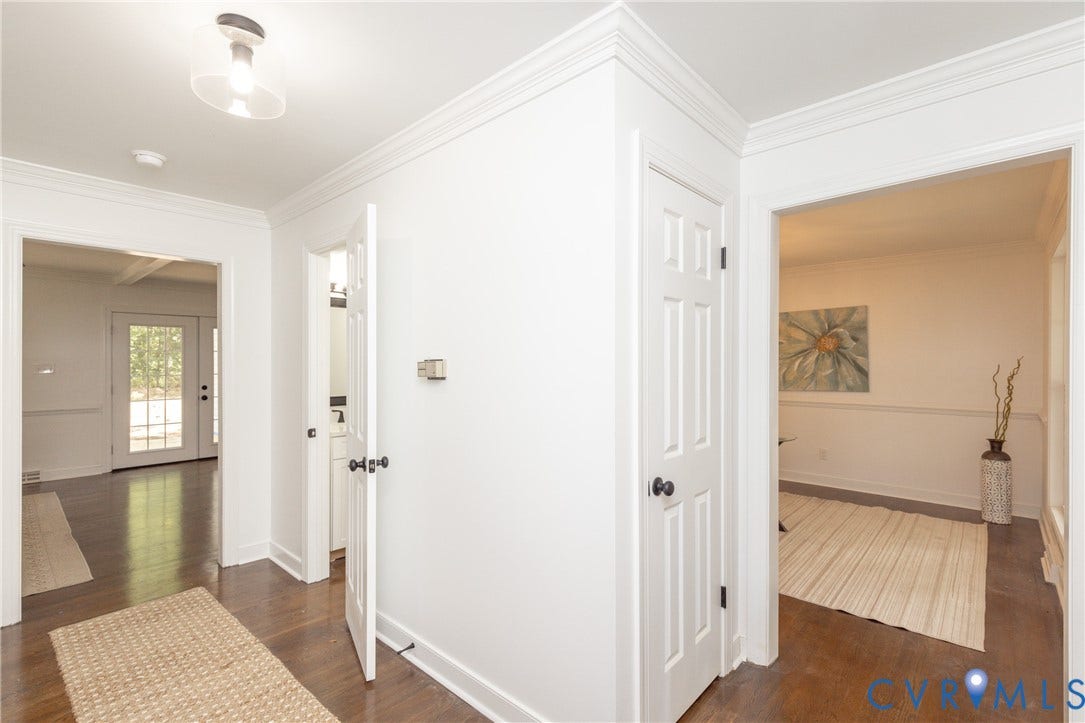 10541 Glencoe Road, Henrico, VA 23060 Hardwood flooring, crisp white walls, crown molding, white paneled doors, and a full-light rear door