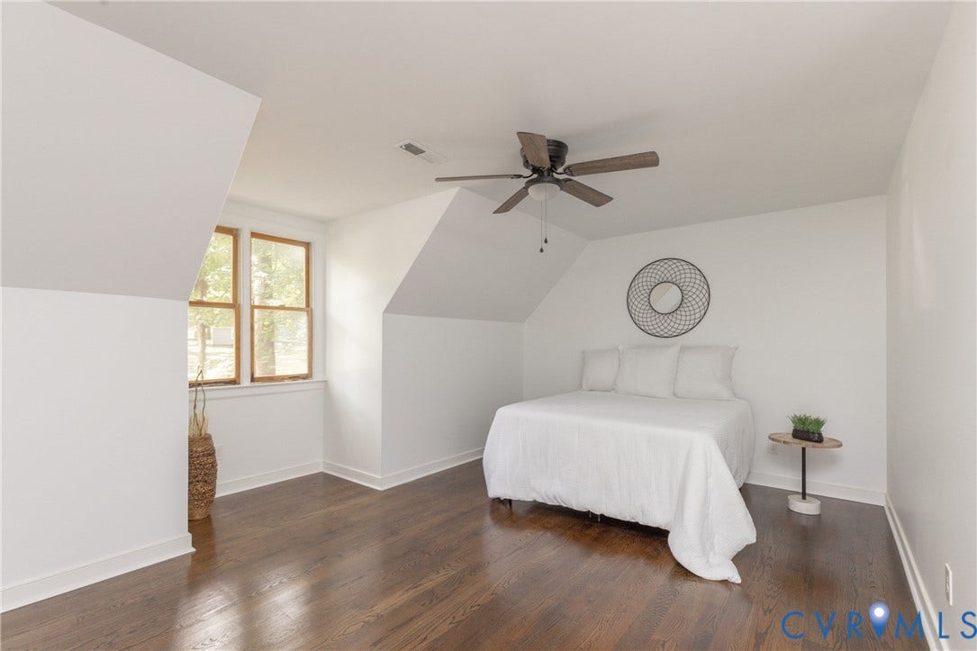 10541 Glencoe Road, Henrico, VA 23060 Hardwood flooring, painted white walls, wood-framed window, sloped ceilings, and a ceiling fan