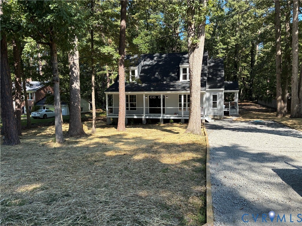 10541 Glencoe Road, Henrico, VA 23060 Gabled roofline with dormer windows, covered front porch, light-toned siding, gravel driveway, and mature trees