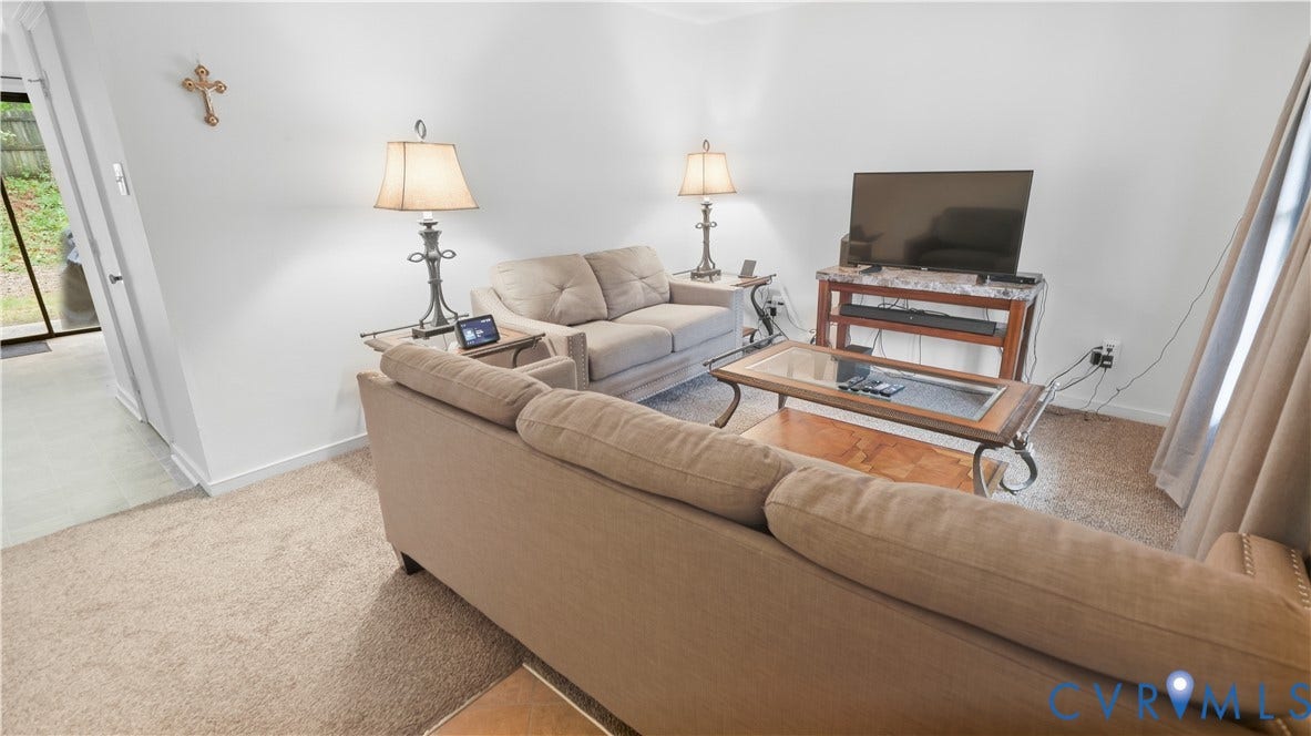 15253 Broadwater Circle, Chester, VA 23831 Neutral-toned wall paint, carpeted flooring, and a glass-paneled door to an exterior space