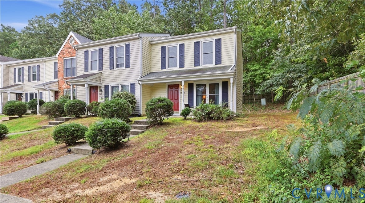 15253 Broadwater Circle, Chester, VA 23831 Siding exterior with contrasting shutters, covered entry, and a sloped front yard