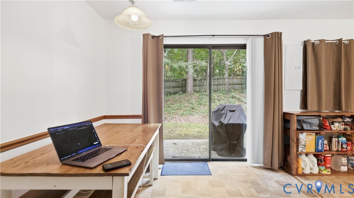 15253 Broadwater Circle, Chester, VA 23831 Sliding glass door, outdoor patio, and a privacy fence