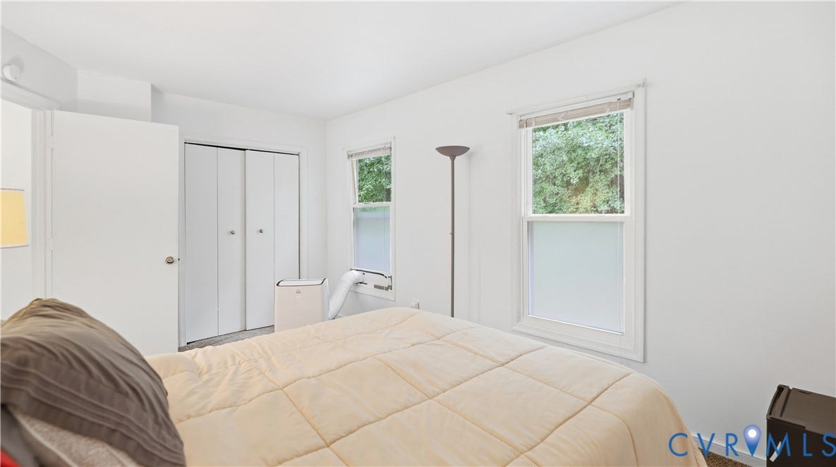 15253 Broadwater Circle, Chester, VA 23831 White walls, a white door, and white bi-fold closet doors
