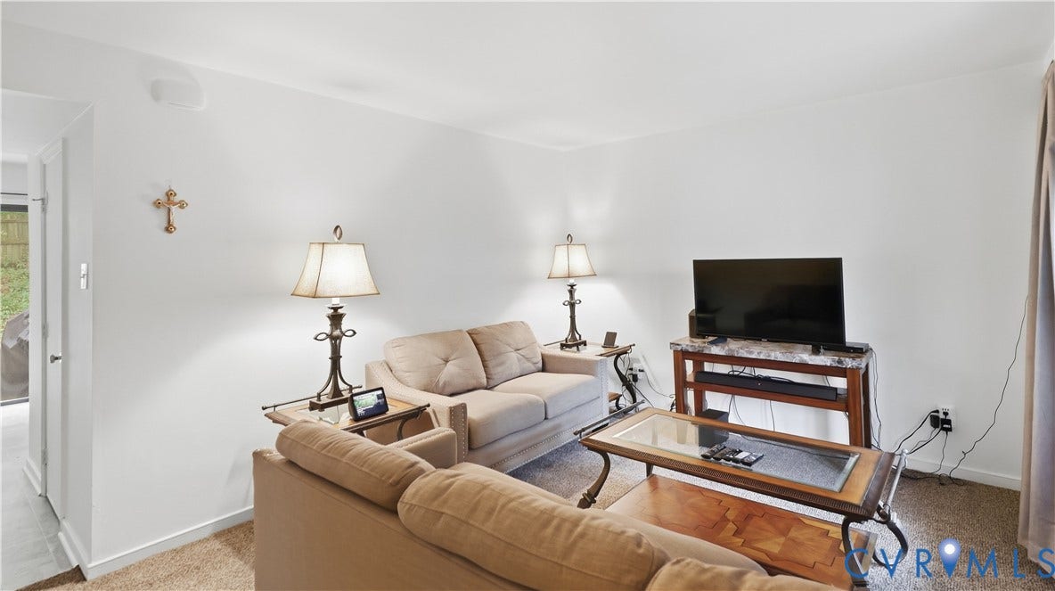 15253 Broadwater Circle, Chester, VA 23831 Carpeted living area with white walls and a ceiling-mounted light fixture