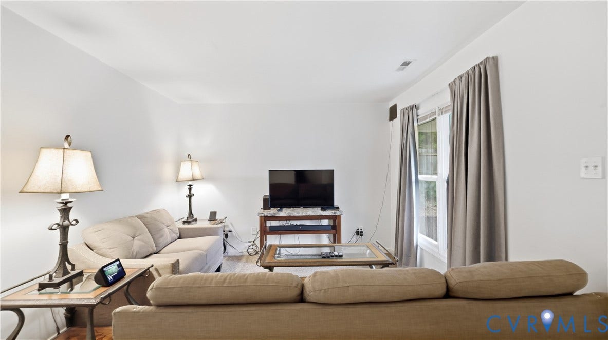 15253 Broadwater Circle, Chester, VA 23831 Hardwood-style flooring, white wall finishes, and a window with natural lighting