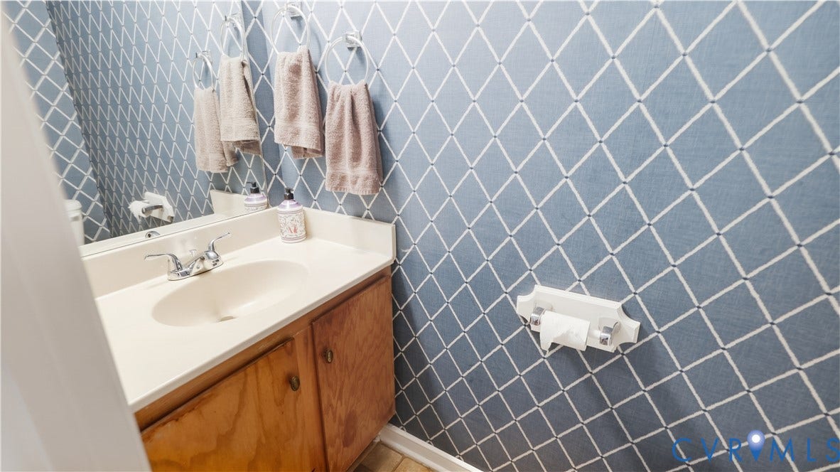 15253 Broadwater Circle, Chester, VA 23831 Single vanity with a light-toned countertop, integrated oval sink, and chrome faucet