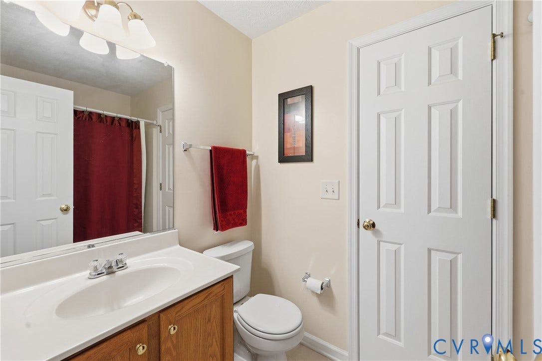 A full bathroom near the secondary bedrooms adds convenience to the home's flexible upstairs layout