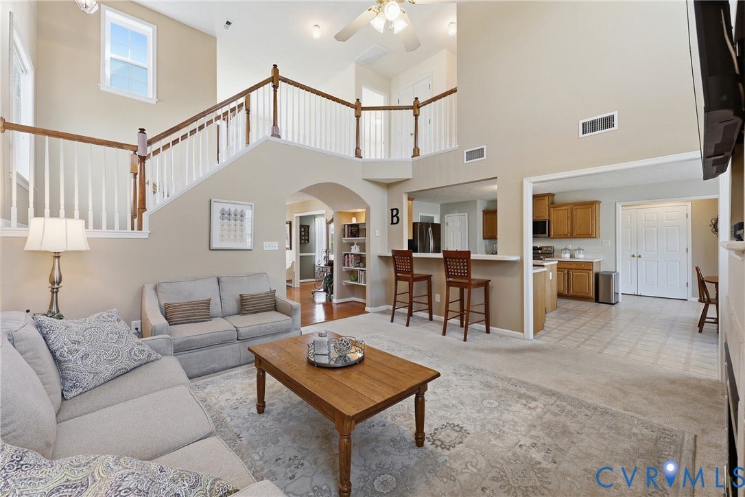 An open living room connects to the kitchen breakfast bar for effortless everyday flow.