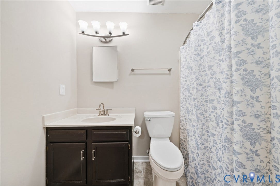 1852 Timberly Waye, Henrico, VA 23238 Bathroom featuring a dark wood finish vanity with integrated sink, white countertop, and brushed nickel faucet