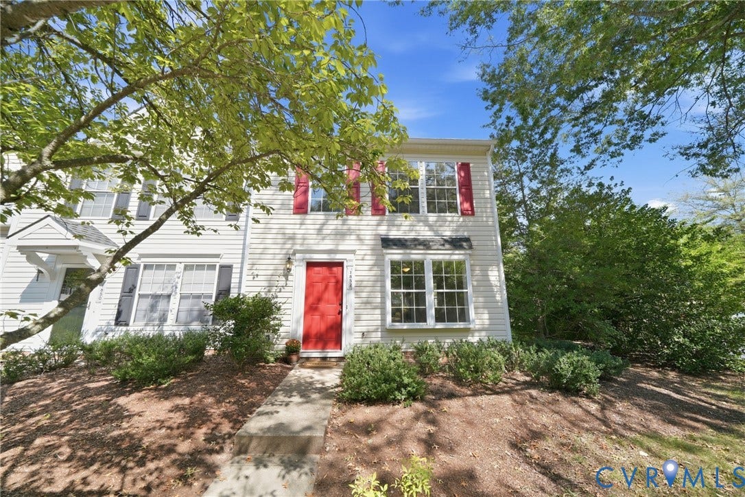 1852 Timberly Waye, Henrico, VA 23238 Two-story exterior with white siding, red entry door, and red window shutters