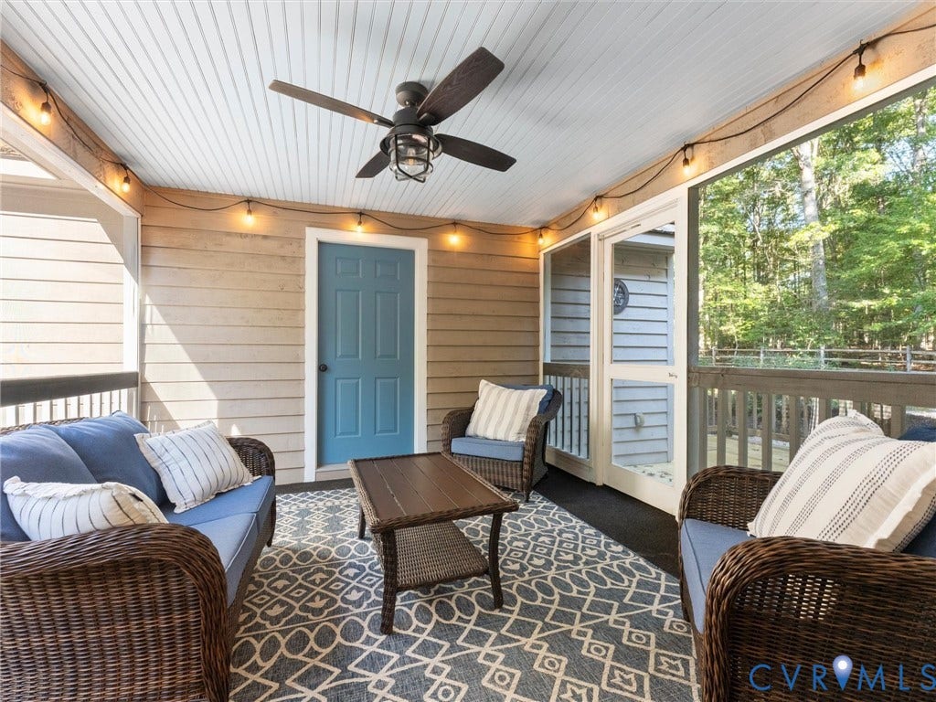 3801 Old River Trail, Powhatan, VA 23139 Screened-in porch featuring horizontal wood siding, a beadboard ceiling with a centered ceiling fan, and string lighting