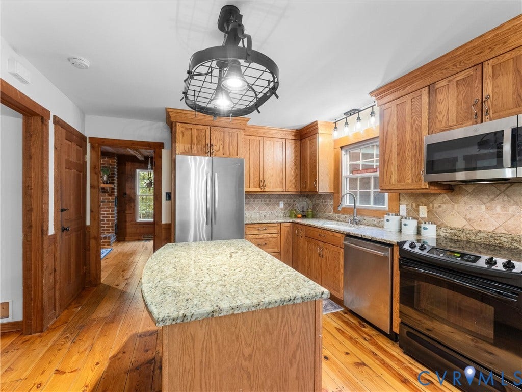 3801 Old River Trail, Powhatan, VA 23139 Kitchen featuring natural wood cabinetry, stone-finish countertops, stainless steel appliances, wood flooring, and a decorative metal-frame overhead light fixture
