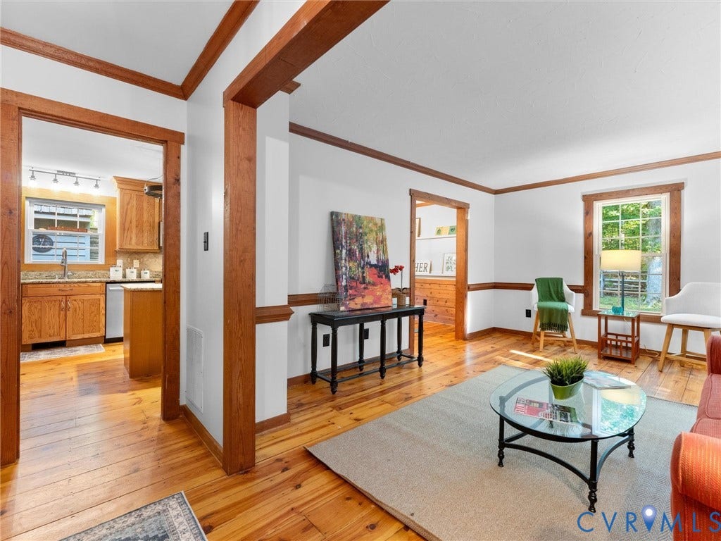 3801 Old River Trail, Powhatan, VA 23139 Natural wood flooring, stained wood door and window casing, chair rail molding, and multi-paned windows